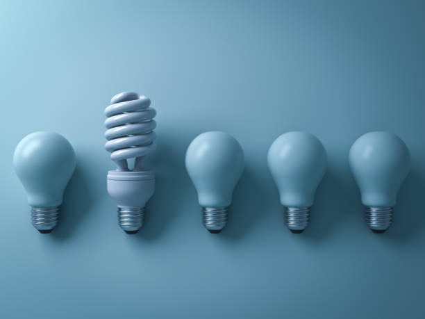 istock One eco energy saving light bulb different and stand out from old incandescent lightbulbs on cyan background with shade and shadow , individuality and different creative idea concept . 3D render 664317284