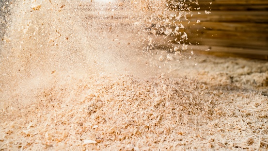 Close-up of sawdust in air.