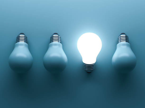 istock One glowing light bulb standing out from the unlit incandescent bulbs on green background with reflection , individuality and different creative business bright idea concepts . 3D render 664317604