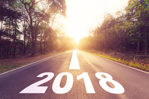 istock Empty asphalt road and New year 2018 goals concept. 664324386