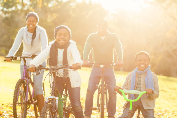istock Young smiling family doing a bike ride 664329796