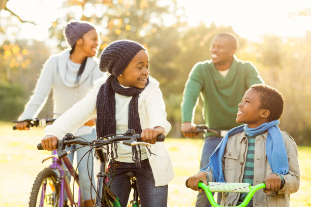 istock Young smiling family doing a bike ride 664331960