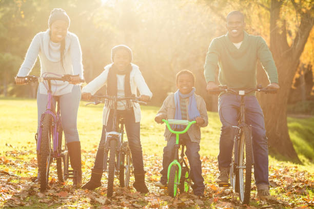 istock Young smiling family doing a bike ride 664332148