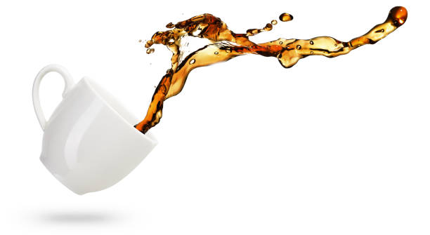 coffee flow spilling out of a cup coffee spilling out of a mug isolated on white background tea spill stock pictures, royalty-free photos & images
