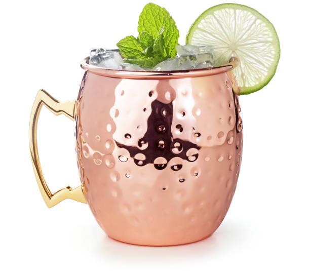moscow mule cocktail in a copper mug isolated on white stock photo