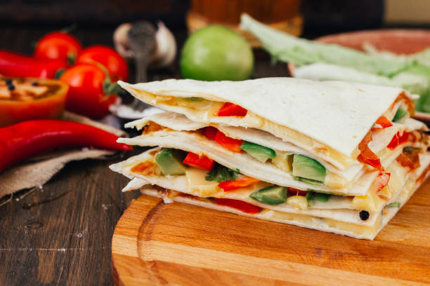 istock Nice vegetarian quesadilla with tortilla bread, beans, cheese and vegetables. 664337018