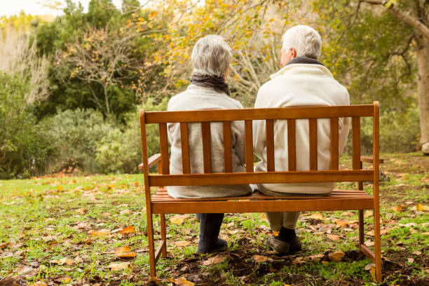 istock Senior couple in the park 664343612