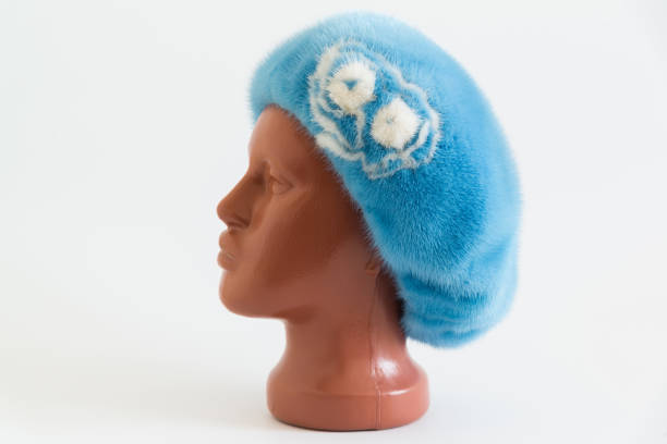 istock light blue beret from natural mink on mannequin. Side view 664343658