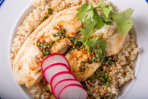 istock Pan Grilled Tilapia over Brown Rice 664347240