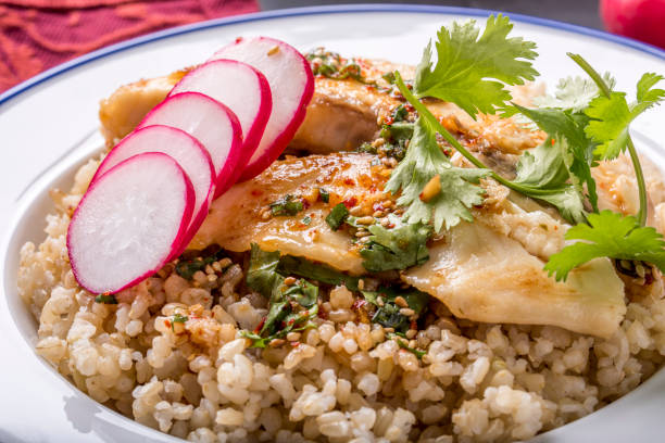 istock Pan Grilled Tilapia over Brown Rice 664347438
