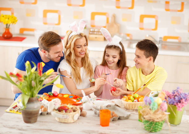 istock Family painting Easter eggs 664348244