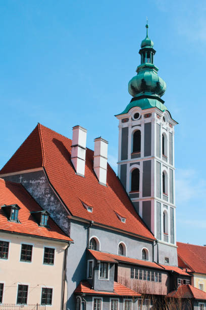 istock Church in Cesky Krumlov with house 664349112