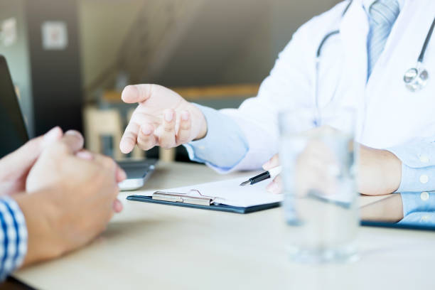 istock Doctor and patient are discussing something, just hands at the table 664349764