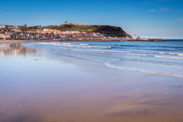 Scarborough's South Bay Scarborough is a town on the North Sea coast of North Yorkshire.  Castle Hill separates the seafront into two bays to the North and South headland photos stock pictures, royalty-free photos & images