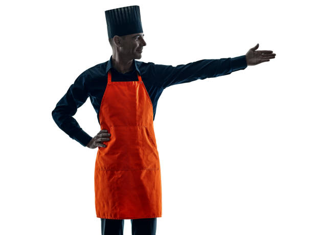 istock man cooking chef silhouette isolated 664352874