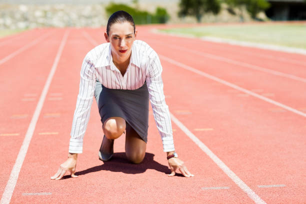istock Businesswoman in ready to run position 664352902