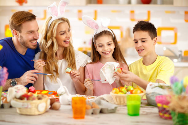 istock Family painting Easter eggs 664353180