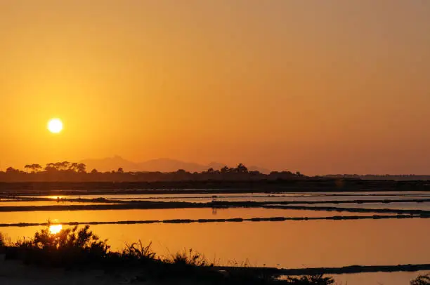 Photo of Sunset at the saltpans of Trapani