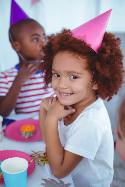 istock Excited kids enjoying a birthday party 664357186