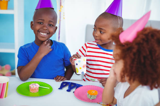 istock Excited kids enjoying a birthday party 664357258