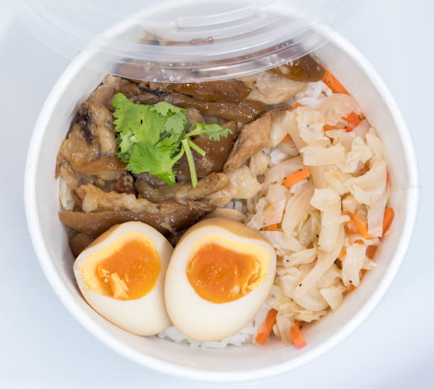 istock Stewed pork leg on rice; fresh ham on rice 664363434