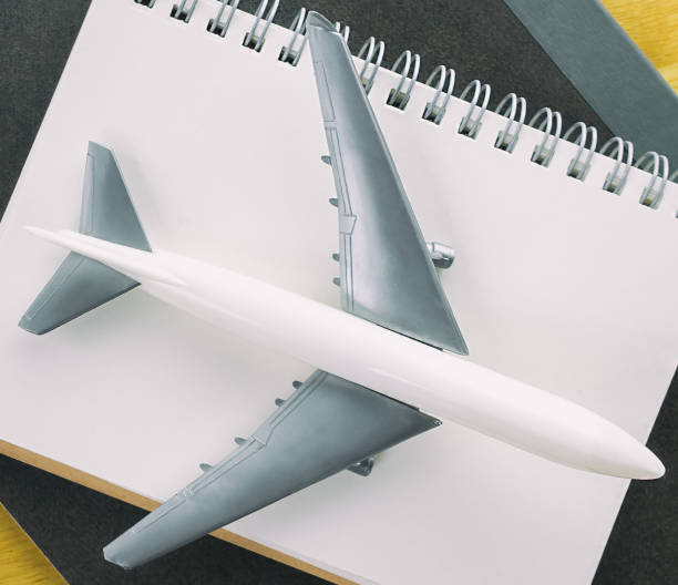 istock Travel Blogger journal book with aeroplane concept 664371286