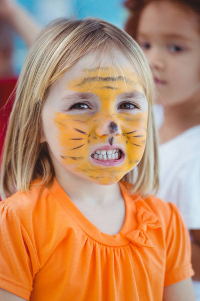 istock Happy girl with her face painted 664374704