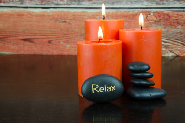 istock lava stones and burning candles 664378620