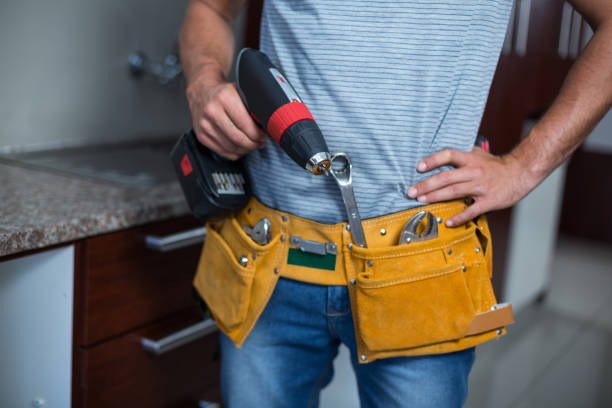 istock Midsection of man holding cordless hand drill 664379280