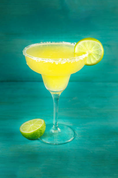 istock Lemon Margarita cocktails on vibrant turquoise with copyspace 664381816