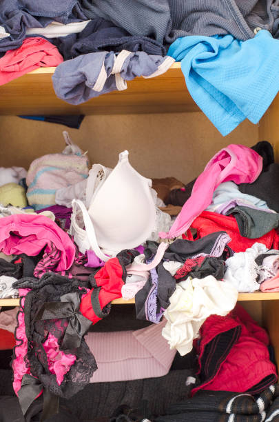 istock Pile of carelessly scattered clothes in wardrobe 664383098