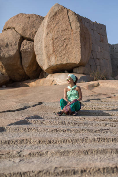 istock The girl is sitting on the steps 664385456