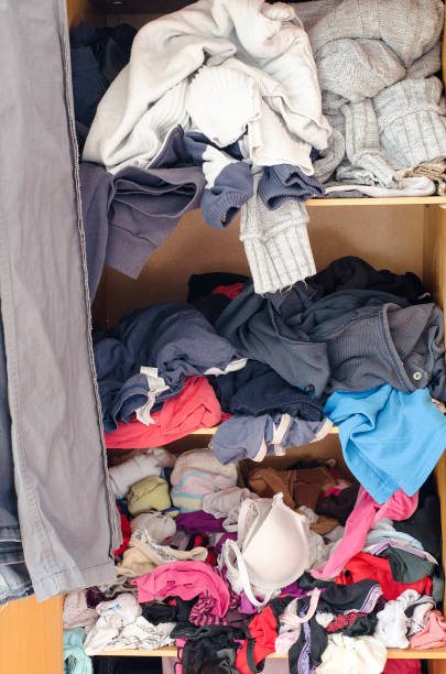 istock Pile of carelessly scattered clothes in wardrobe 664385466