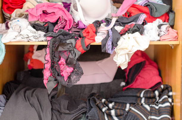 istock Pile of carelessly scattered clothes in wardrobe 664386070