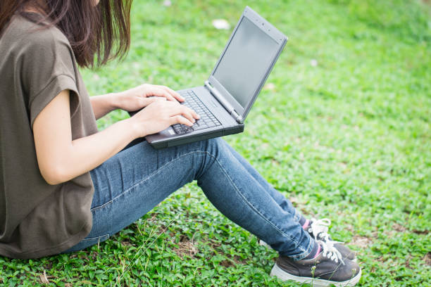 istock technology modern lifestyle, teen women student using laptop computer with business data working in university. 664386162