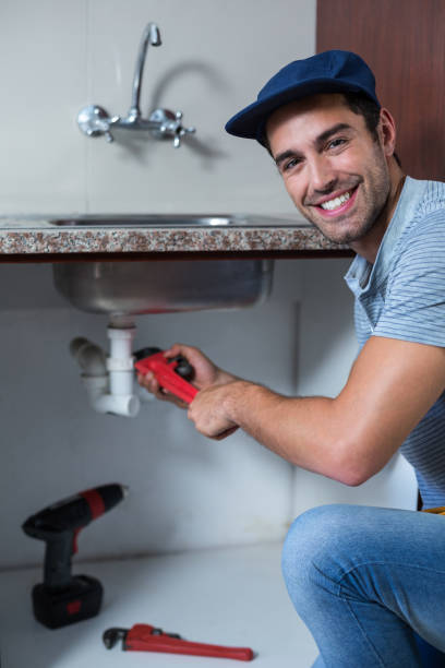 istock Portrait of man using pipe wrench 664386482