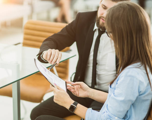 istock successful business team is analyzing marketing reports at the w 664386648