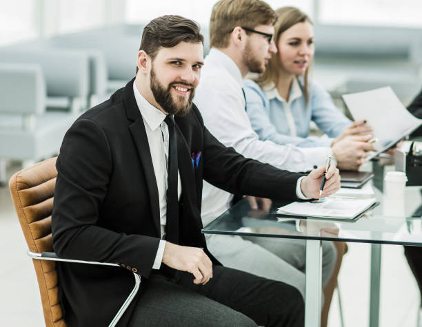 istock Manager and business team working with financial reports in the 664386704