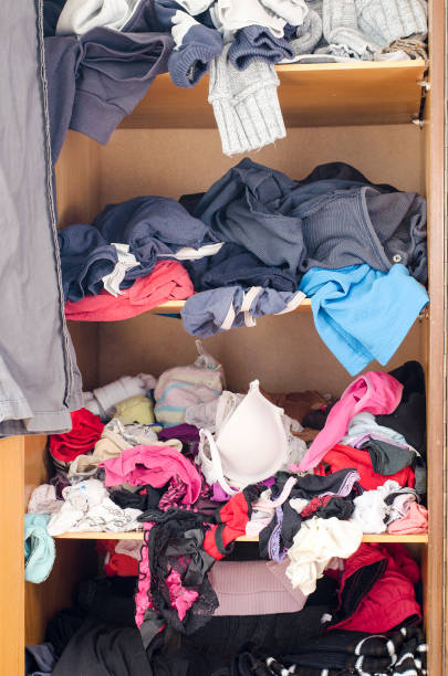 istock Pile of carelessly scattered clothes in wardrobe 664389524