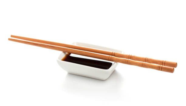 istock Soy sauce and chopsticks isolated on white background, with clipping path 664389880