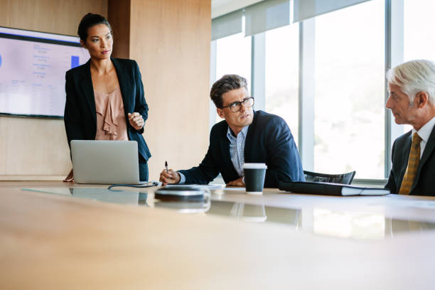 istock Businesspeople sitting at corporate meeting 664389926