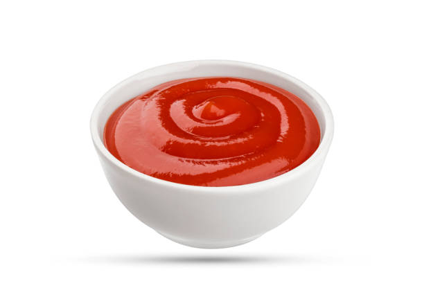 istock Ketchup bowl isolated on white background 664390386