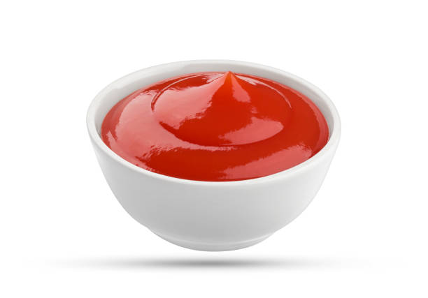 istock Ketchup bowl isolated on white background 664390426