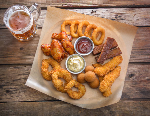 istock Mug with beer and a beer snack 664390572