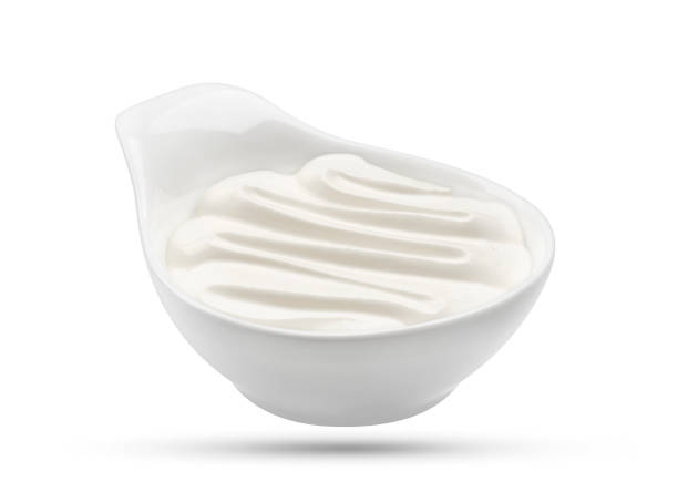 istock Sour cream in bowl isolated on white background 664392744