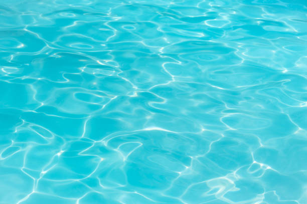 istock Beautiful ripple wave and blue water surface in swimming pool 664393320