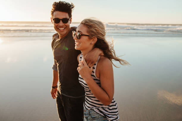 istock Man and woman on beach holiday 664393978