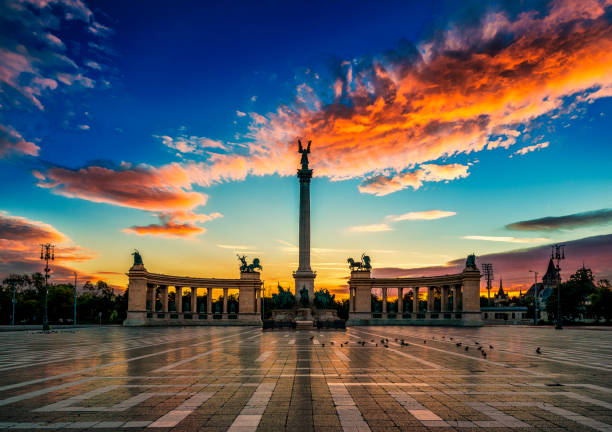 Heroes' Square is one of the major squares of Budapest, Hungary, rich with historic and political connotations. Its iconic statue complex, the Millennium Memorial, was completed in 1900, the same year the square was named \