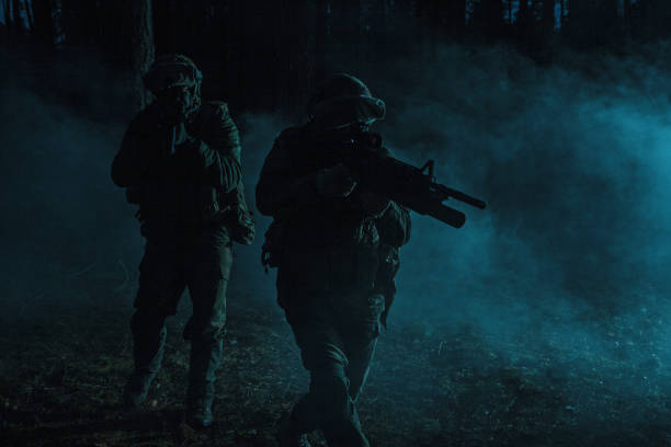 istock Black silhouettes of soldiers 664406586