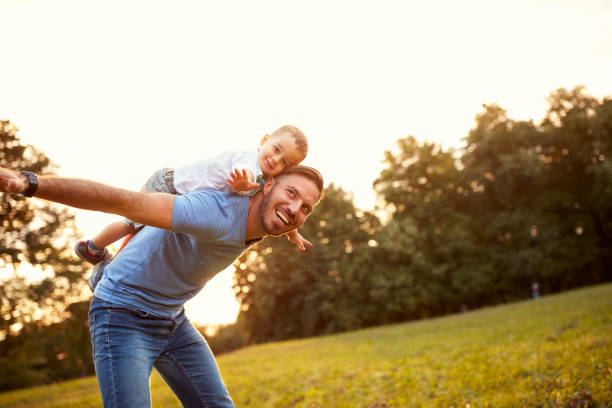 istock Father piggyback his son outside 664409878